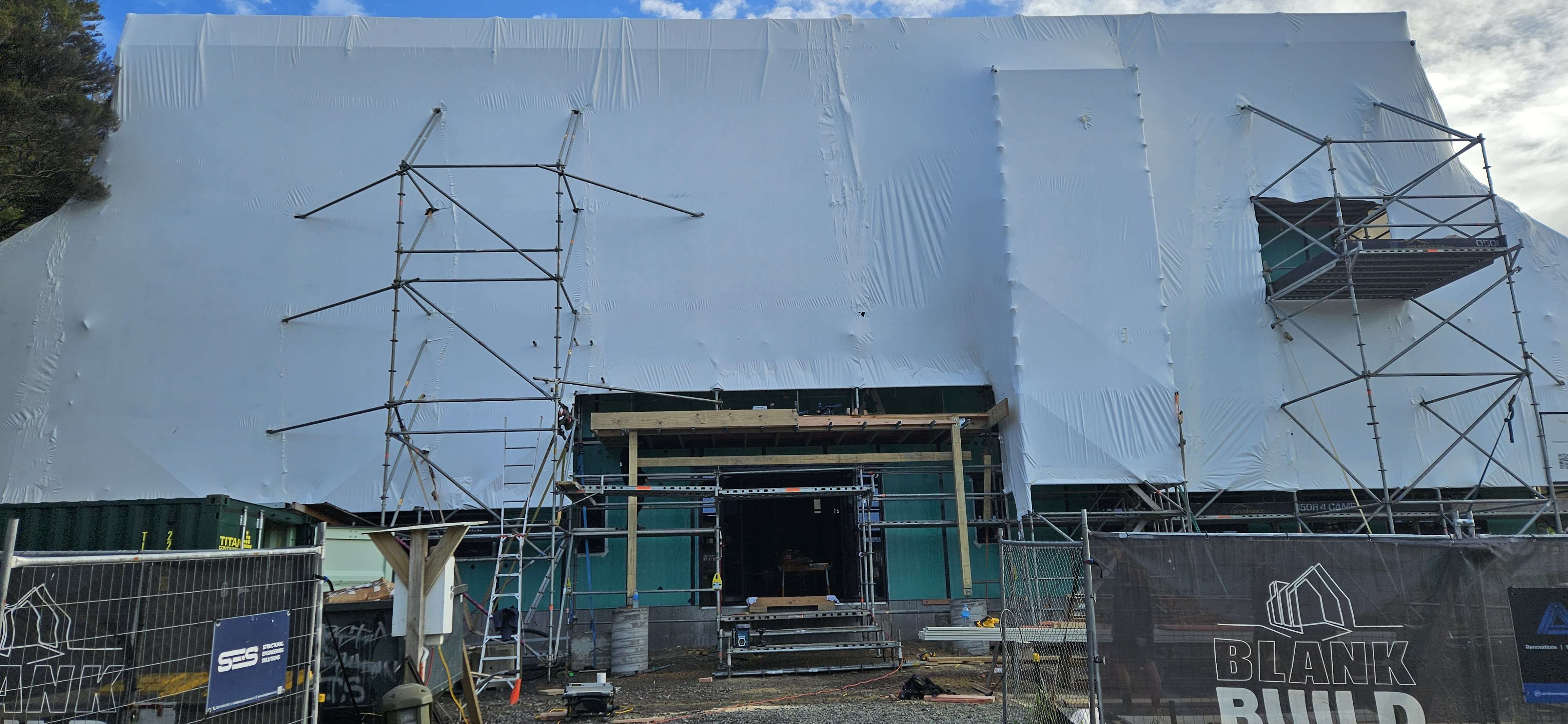 Front of the The Academy main building, wrapped