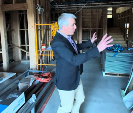 Tristan O'Hanlon giving a tour of the main building